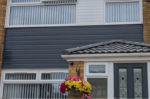 Grey Anthracite cladding on front house facade.